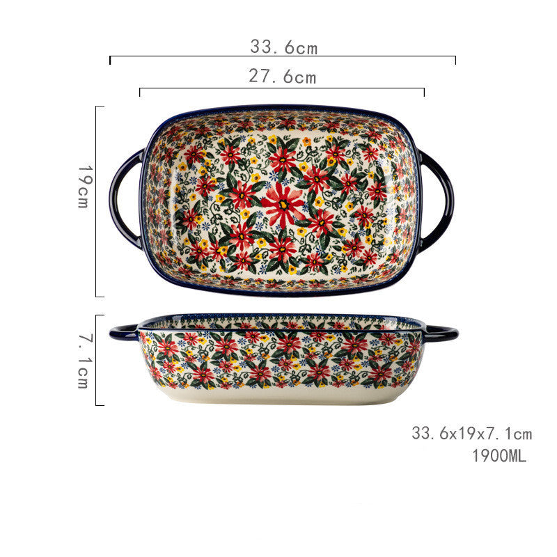Färgglad keramisk ugnsform med handtag och blommönster.