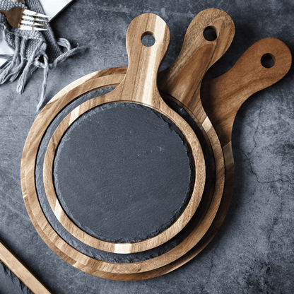 Rustik wooden serving board with slate surface and handle for cheese, tapas and charcuterie.
