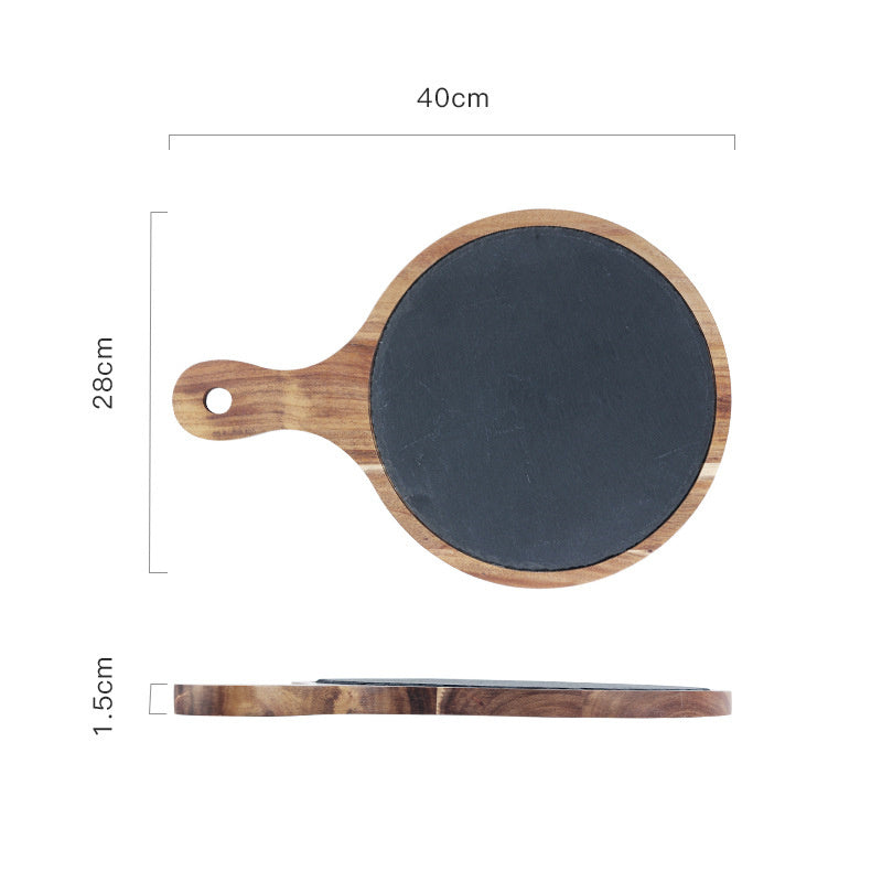 Rustik wooden serving board with slate surface and handle, highlighting its unique blend of materials.