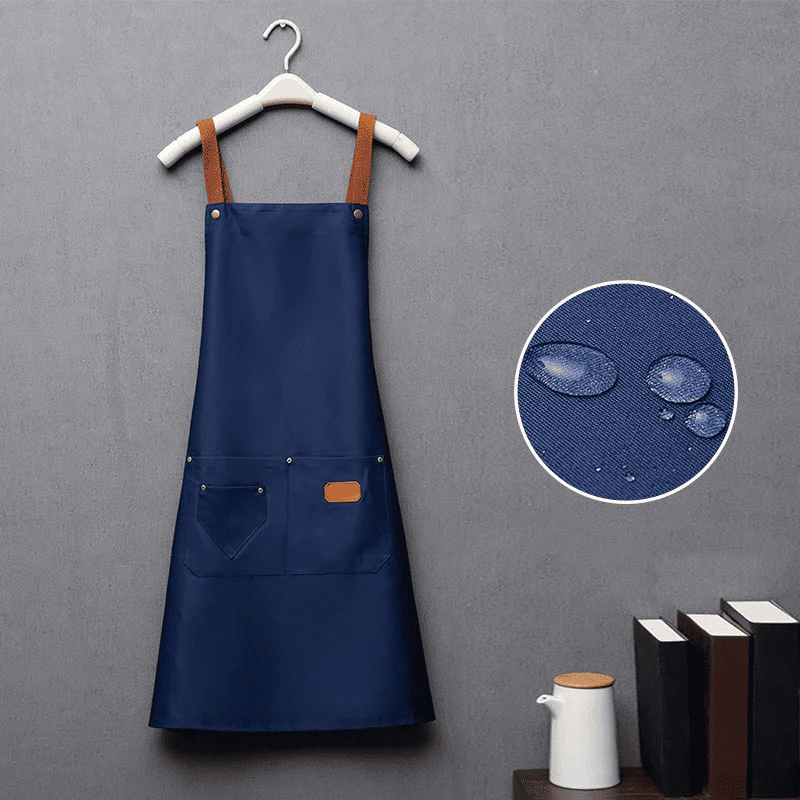 Unisex kitchen apron with adjustable straps and pockets, made from Oeko-Tex certified cotton