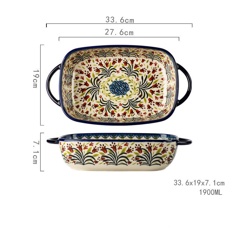Färgglad keramisk ugnsform med handtag och blommönster.